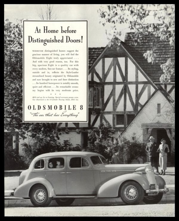 1936 Oldsmobile 8 Vintage Ad - "At Home before Distinguished Doors"